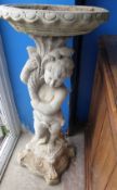 A Stone Garden Bird Bath, depicting a cherub, approx 95 cms high.