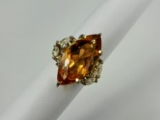 A Lady's 10.34 Ct Imperial Topaz 18 Ct White Gold and Diamond Ring, the exquisite peach coloured