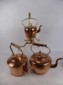 Two Antique Copper Kettles, together with a copper and brass spirit kettle.