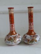 A Pair of 19th Century Japanese Vases, the vases depicting pheasants amongst gilded flowers,