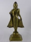 A 19th Century Brass Sin-Tibetan Figure of Buddha, the figure standing with arm raised pointing