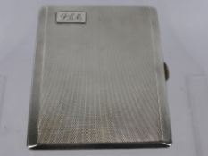 A Solid Silver Engine Turned Cigarette Case, the case having gilded interior and engraved "Presented