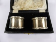 A Pair of Silver Napkin Rings, Birmingham hallmark, mm W.H. Manton Ltd., dd 1967 in the original box