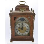 A Thomas Smith London Bracket Clock in Walnut Case, the 6" brass arched dial marked Thomas &
