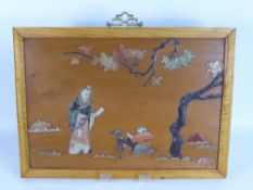 A 19th Century Chinese Soapstone Inlaid Fruitwood Panel, the decorative inlay depicting a figure