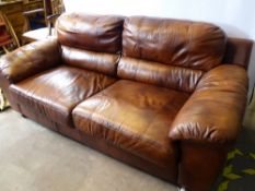 A Tan Leather Three Seater Sofa, with fire regulation certificate, approx 78 x 93 x78 cms.