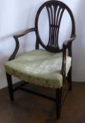 An Antique Mahogany Hepplewhite Style Oval Back Arm Chair, the chair having swag and laurel design