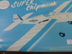 A Boxed Unassembled Kit Super Chipmunk 0.49 Engine Powered Stunt Flyer, together with instructions.