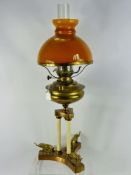 An Antique 'Lampe Veritas' Brass Oil Lamp, raised on a classical column form base depicting brass