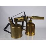 Three Vintage Brass Blow Torches, including Burmos, The Premier, Smallwood Bros., and the Monitor