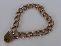 A 9 ct Rose Gold Curb Link Bracelet, with heart shaped clasp, approx wt 10.9 gms.
