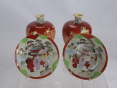 A Pair of Japanese Satsuma Ware Onion Vases, depicting warriors together with three Japanese sweet