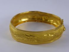 A Chinese 999.9 Pure Gold Wedding Bangle, the bracelet depicting chasing dragons, mm PW, character