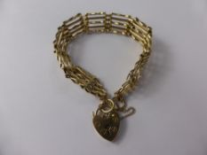 A 9 ct Yellow Gold Gate Link Bracelet with Heart Shaped Clasp, approx 13.9 gms.