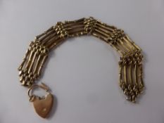 A Lady's 9 ct Gold Gate Link Bracelet with Heart Shaped Clasp, approx 17.3 gms.