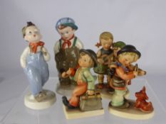 Three Ceramic Goebel Figures, depicting girls singing, a boy playing his violin and a Hummel