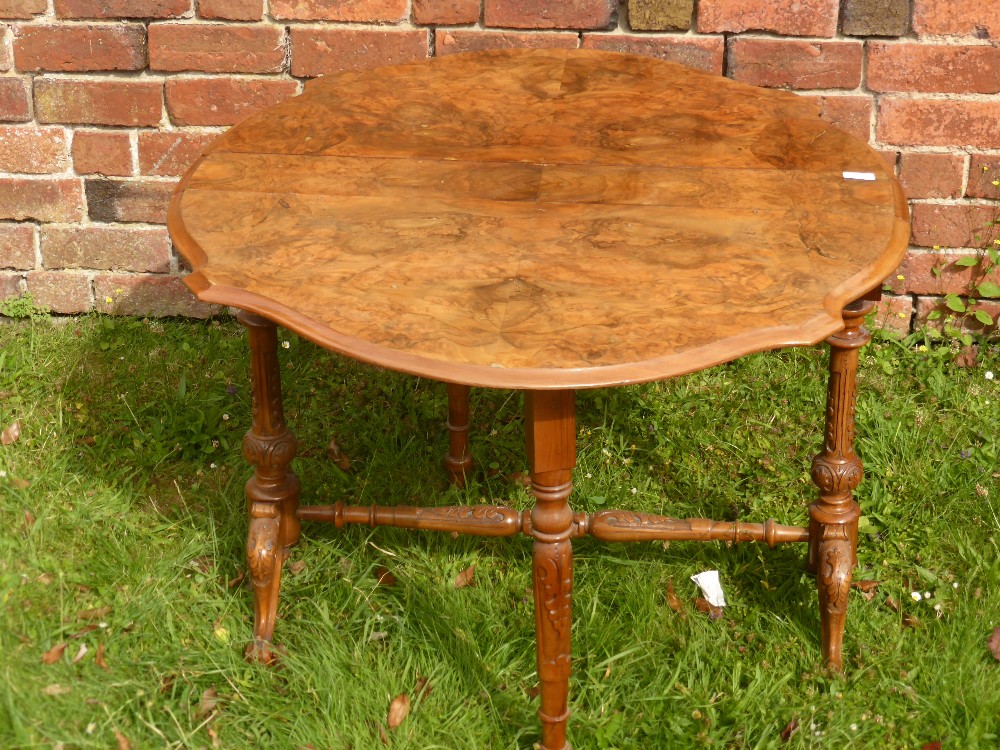 A 19th Century Walnut Veneer Drop Leaf Table, on ornately carved legs and stretchers, approx 109 x - Bild 2 aus 2