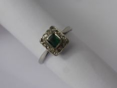 An Antique Platinum, Emerald and Diamond Ring, emerald 4.6 x 4 mm, 14 x 8 cut dias, size M, approx