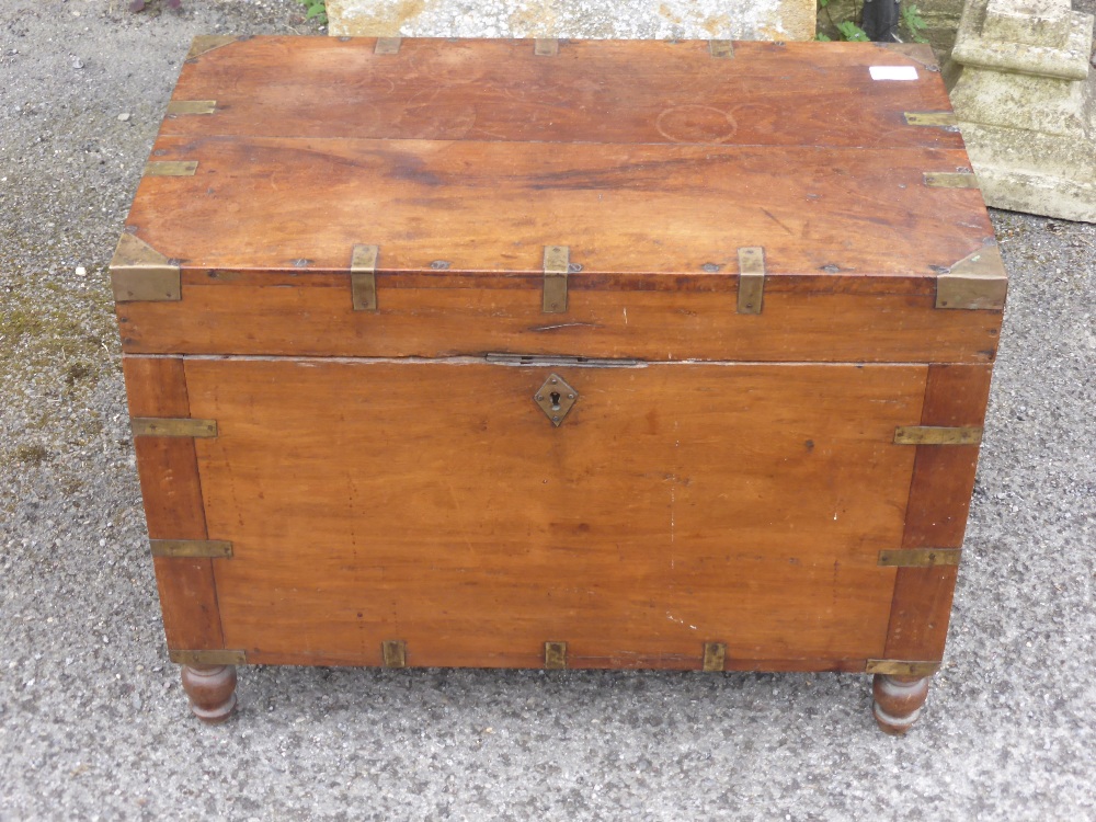 A Georgian Mahogany Campaign Chest, the chest having panel lidded candle box with letter rack, on