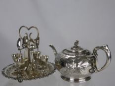 A Silver Plated Egg Cup Stand, with egg cups and spoons together with a tea pot with foliate finial.