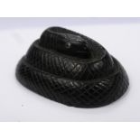 An Antique Japanese Ebony Carved Netsuke, in the form of a coiled snake, with enamel eyes, approx