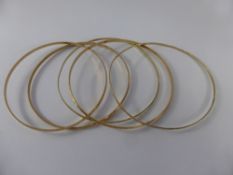 Five 9 Ct Gold Bangles, three rose and two yellow gold, combined wt 15.2 gms.