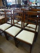 Six Antique Oak Ladder Back Dining Chairs with two Carvers, in the Arts & Crafts style, turned