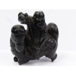 An Antique Japanese Ebony Carved Netsuke, depicting a mounted warrior, approx 4.5 x 4 cms (af)