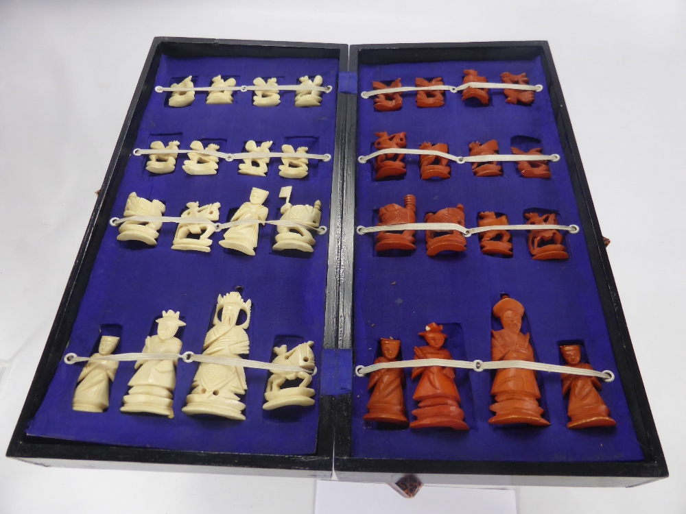 A Bone Chess Set, in the original box together with a Chinese game and a child's miniature black