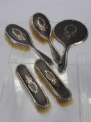 An Early 20th Century Tortoiseshell and Silver Dressing Table Set, London hallmark, dated 1926/27,