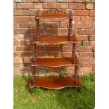 A Victorian Mahogany "What Not", four serpentine shelves, on barley twist supports, approx 75 x