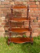 A Victorian Mahogany "What Not", four serpentine shelves, on barley twist supports, approx 75 x