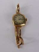 A Lady's 9 ct Gold Reid Cocktail Watch, wt of case and bracelet 8.8 gms