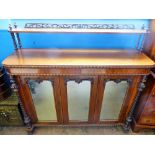A Mahogany Sideboard, raised gallery with decorative carving, three glazed fronted cupboards