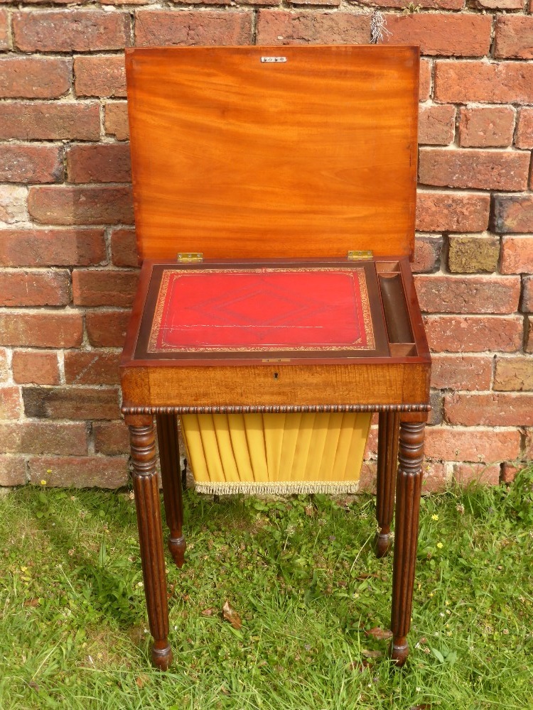 A Lady's 19th Century Work Table, a red tooled leather writing slope with fitted interior, single