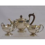 A Silver Tea Trio, of unique design, including tea pot approx 786 gms, milk jug approx 252 gms sugar