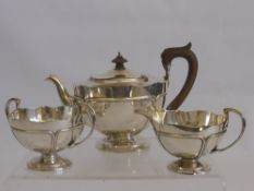 A Silver Tea Trio, of unique design, including tea pot approx 786 gms, milk jug approx 252 gms sugar