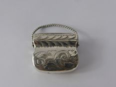 A Silver Hallmark Vinaigrette, in the shape of a small purse, with swing handle, Birmingham 1780,