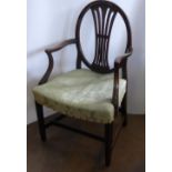 An Antique Mahogany Hepplewhite Style Oval Back Arm Chair, the chair having swag and laurel design