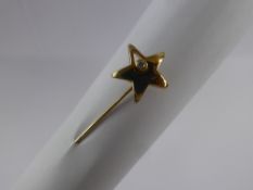 A 9 ct Gold Ortak and Diamond Tie Pin, in the form of a star, approx 2.2 gms.