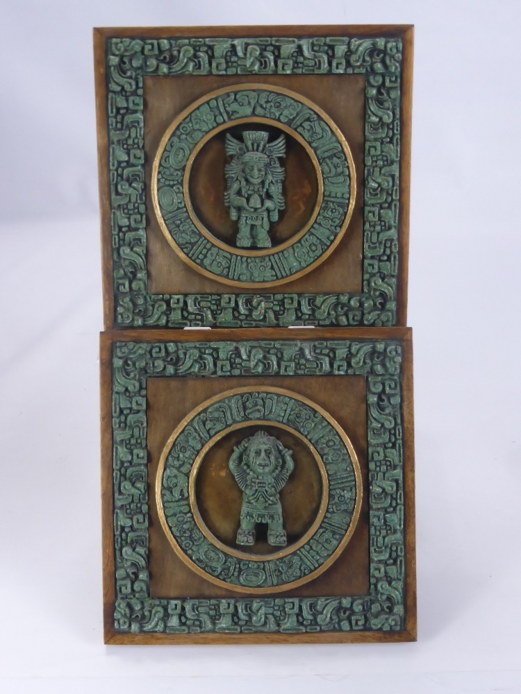 A Pair of Oak Wall Plaques Depicting Mayam Iconography, approx 30 x 30 cms.