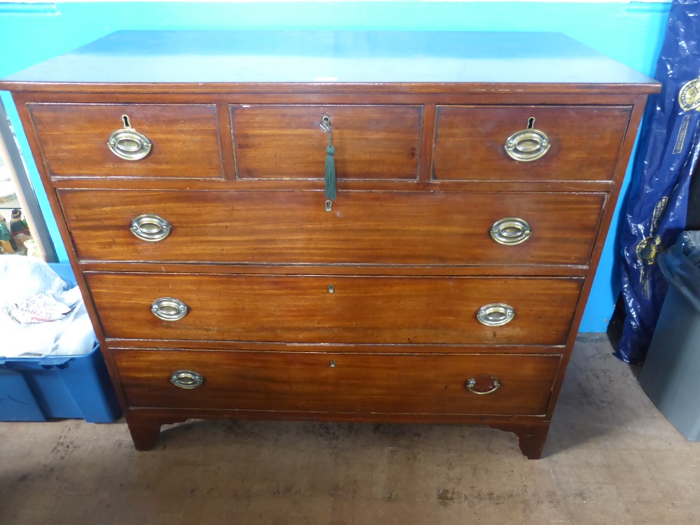 A Mahogany Chest of Drawers, three short drawers, three graduated long drawers on bracket feet, oval