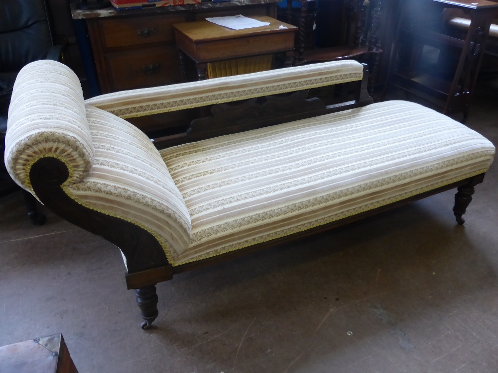 A Pair of Edwardian Arm Chairs, with swept arms, on turned legs and casters, decorative carving to - Bild 2 aus 2