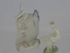 A Lladro Porcelain Figure of a Goose, together with a Lladro Society scroll. (2)