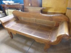 A Hardwood Empire Style Rattan Seated Couch, the couch having shaped legs with carved swan neck