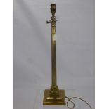 Two Antique Regency Style Brass Lamp Stands, both with ribbed column, one having three eagles to