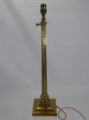 Two Antique Regency Style Brass Lamp Stands, both with ribbed column, one having three eagles to