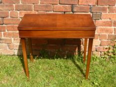 A Mahogany Card Table, the interior fitted with green baize, supported on tapering legs, approx 76 x