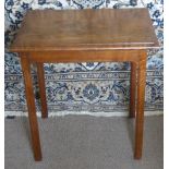 An Antique Arts & Crafts Oak Occasional Table, in the style of Gordon Russell, on hectagonal legs,