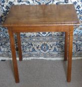 An Antique Arts & Crafts Oak Occasional Table, in the style of Gordon Russell, on hectagonal legs,